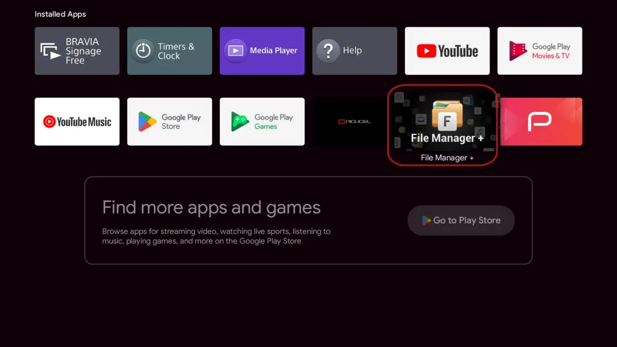 The Android TV home screen with File Manager + selected among the installed apps